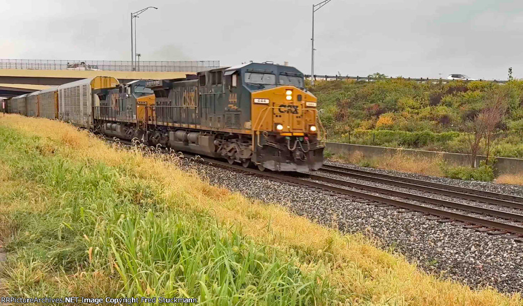 CSX 444 leads M276 through the rain.